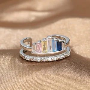 Rainbow crown ring with colorful cubic zirconia stones on silk fabric, adjustable open band
