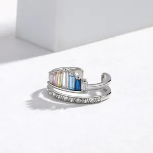 Detailed close-up of rainbow zircon crown ring featuring a double-layered open design