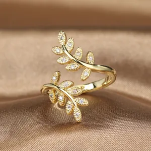 Elegant olive branch adjustable open ring with sparkling white zircons in gold plating