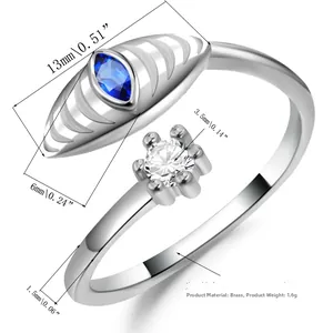 Detail view of adjustable evil eye ring with dimensions, blue stone and brass material