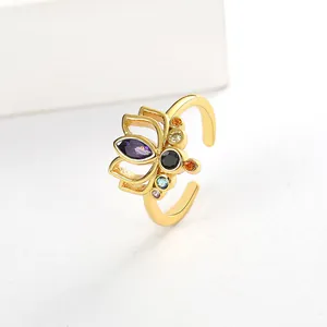 Detailed macro view of the 18k gold-plated lotus ring with vibrant colorful crystals