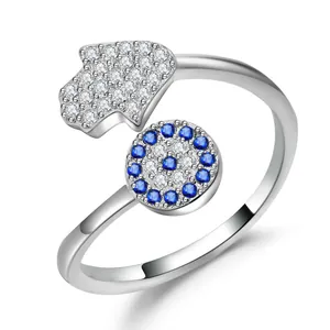 Silver Hamsa Hand and Evil Eye adjustable ring with sparkling blue and white stones