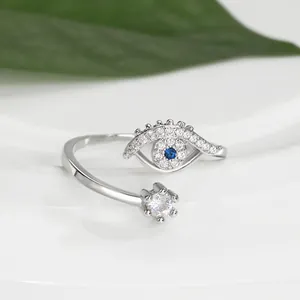 Macro shot of silver evil eye ring featuring blue stone and white zircon details