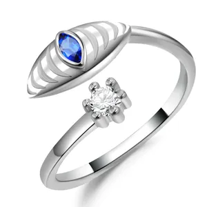Adjustable silver ring with marquise blue stone and round white zircon detail
