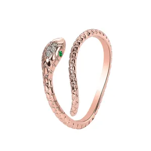 Elegant rose gold snake-shaped open ring with sparkling white and green gemstones