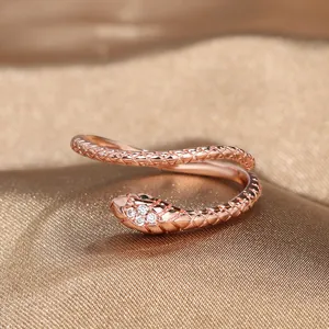 Elegant rose gold snake open ring with sparkling white zircon and green crystal eyes