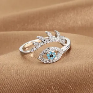 Silver adjustable evil eye ring with blue stone and sparkling cubic zirconia stones