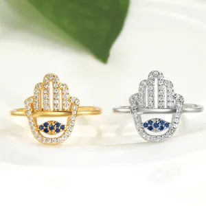 Hamsa Hand Evil Eye open ring in gold and silver finish with blue crystal and zircons
