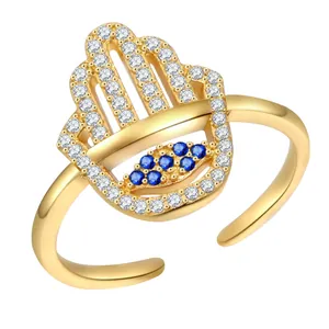 Anello aperto Mano di Fatima dorato con occhio greco blu e pavé di zirconi lucidi
