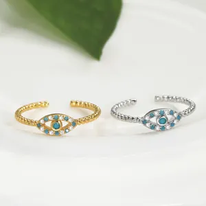 Evil eye open rings in gold and silver finish with blue center stone and white crystals