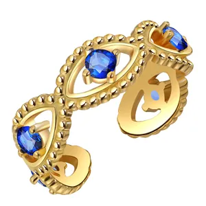 Gold evil eye open ring featuring marquise cutouts and blue round zircon stones