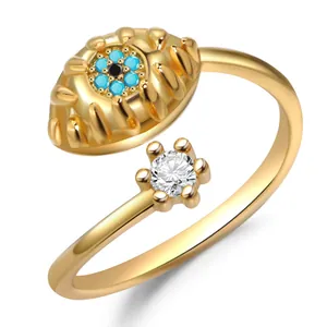 Retro gold open ring featuring a turquoise devil eye and a sparkling cubic zirconia stone