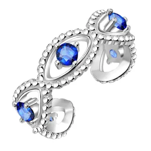 Silver open ring with blue evil eye gemstones and beaded filigree texture on white