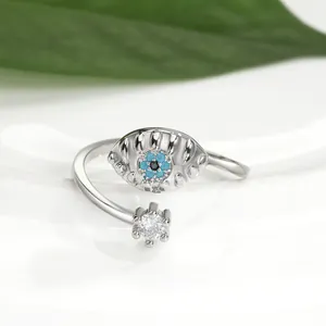 Macro shot of silver Evil Eye open ring with blue turquoise and cubic zirconia details