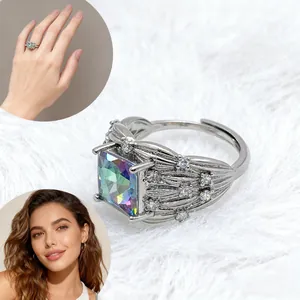 Detailed macro view of silver feather ring with square iridescent blue zircon stone