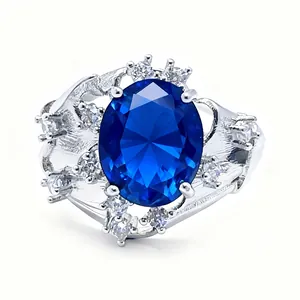 Elegant silver ring with a large oval blue gemstone and shimmering round side stones