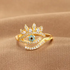 Detailed view of evil eye ring with blue stone and pavé cubic zirconia in gold plating