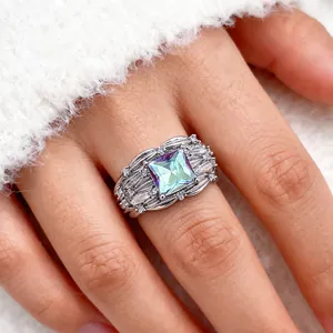 Elegant wide silver ring with square sea-blue zircon and sparkling marquise side stones