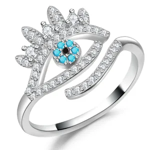 Macro detail of Evil Eye ring showing silver band with blue stones and white zircon inlay
