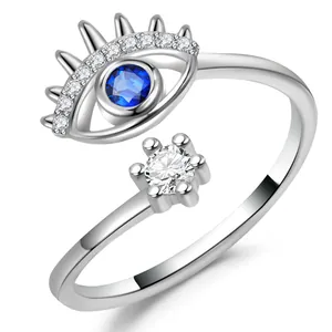 Detail of adjustable silver ring with blue evil eye and sparkling crystals