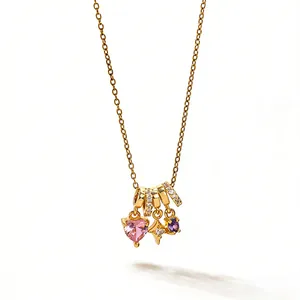 Gold chain necklace with pink heart, purple stone, and star pendant with white zircon