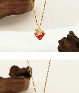 Detailed macro view of strawberry pendant with red base and white cubic zirconia stones