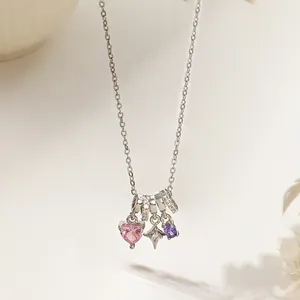 Silver chain necklace featuring pink heart, purple oval crystals and a star pendant