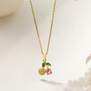 Elegant gold plated cherry pendant necklace with pink gems and shimmering micro-set zircons