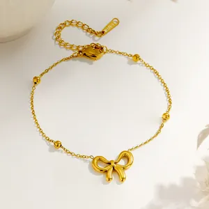Elegantes vergoldetes Edelstahl-Armband mit Schleife und polierten Goldperlen