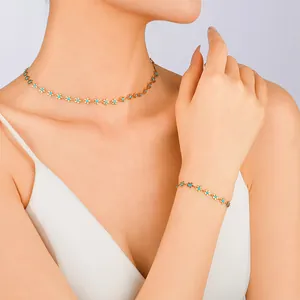 Set gioielli fiore dorato con collana e bracciale smaltati blu per donna