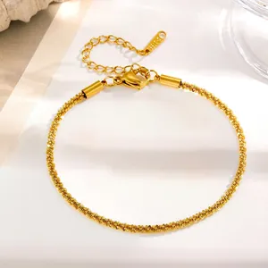 Close-up of 18K gold-plated stainless steel necklace showing S.STEEL engraving and clasp