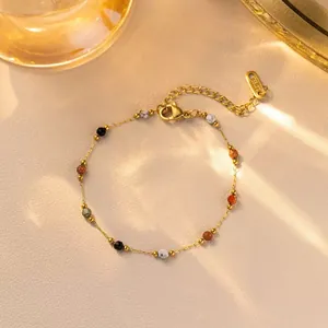 Golden stainless steel beaded necklace featuring colorful marble stone charms and lobster clasp