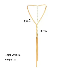 Golden Y-shaped snake bone chain necklace with long tassels and woven metallic texture