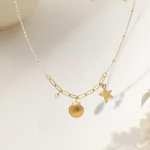 Gold shell and starfish necklace with rhinestones on a delicate chain for women
