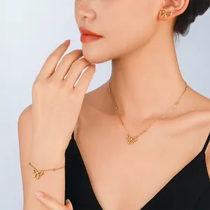 Elegantes goldenes Schleifen-Schmuckset mit Halskette, Armband und Ohrringen aus Stahl