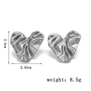 Detail view of gold-plated heart stud earrings with dimensions 2.4cm and weight 8.5g