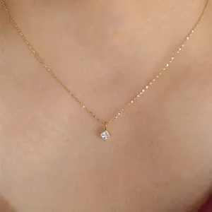Minimalist gold titanium necklace for women featuring a square zircon pendant on the skin