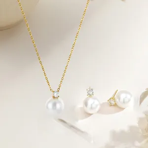 Elegant gold starfish pearl necklace and earrings set with round white pearls