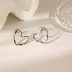 Elegant silver hollow heart-shaped stud earrings made of high-quality titanium steel