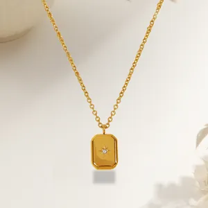 Gold rectangular pendant necklace featuring a starburst pattern and zircon inlay decoration