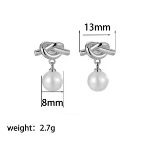Detail view of silver knot earrings with 8mm white pearls and dimensions measurements