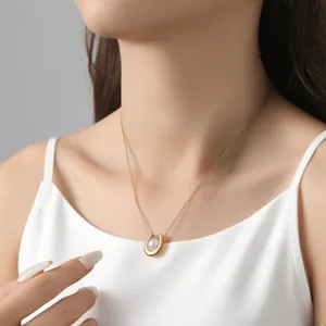 Macro view of 18k gold plated U-shaped necklace with a lustrous white pearl detail