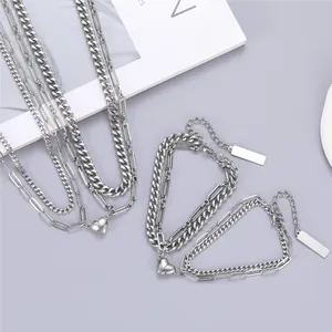 Magnetic heart couple bracelet and necklace set in silver finish with paperclip link chain