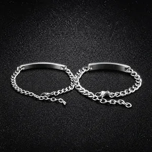 Detail of silver stainless steel Cuban chain bracelets with engravable rectangular plate