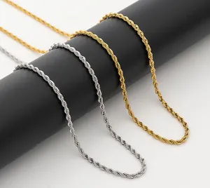 Detailed close-up of gold and silver stainless steel rope chains on black display stands