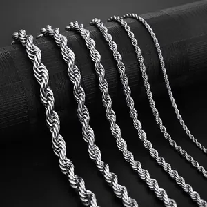 Polished stainless steel rope chains in various diameters on a black display stand