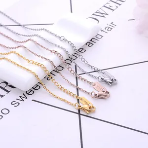 Detail of stainless steel O-chains in gold, rose gold and silver with lobster clasps