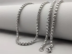 Detailed macro view of silver titanium steel box chain necklace with a lobster clasp