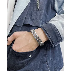 Men's hip hop chunky Cuban chain bracelet in silver polished stainless steel on wrist