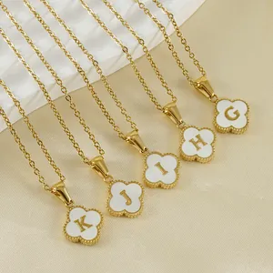 Golden clover pendant necklace with 18k gold plating, white shell inlay and initial letters
